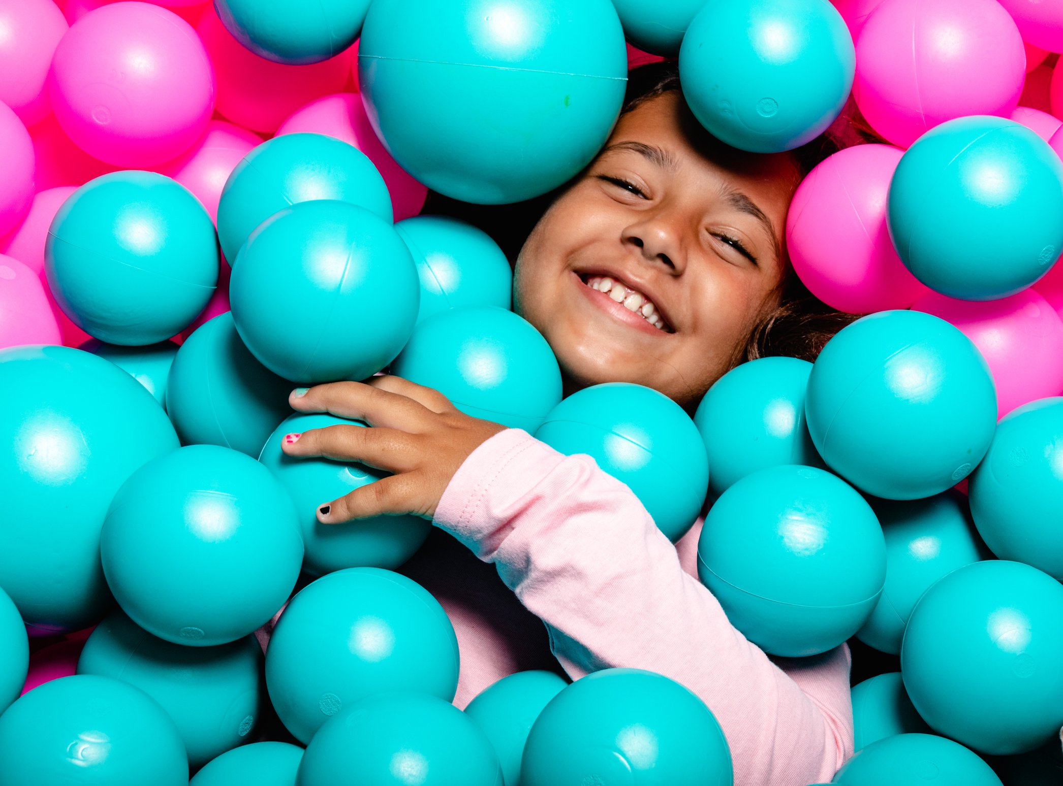 Little Girl Buried in Ball Pit